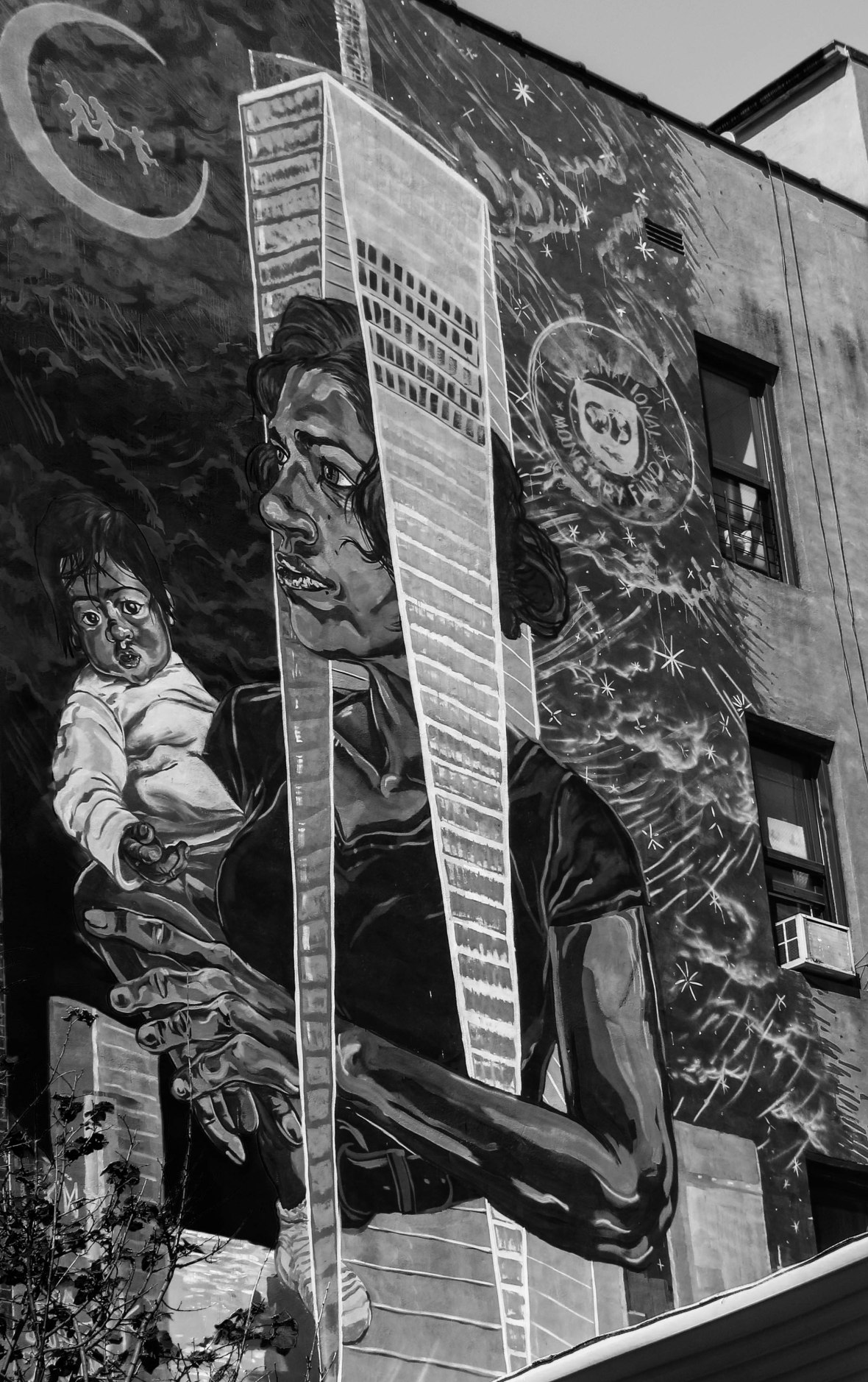 Public Mural: Woman wears Freedom Tower holding child